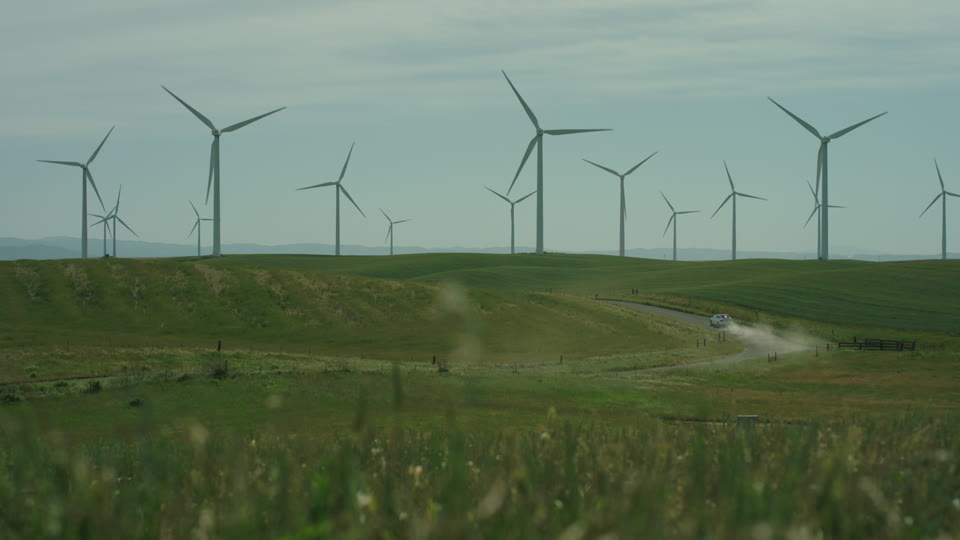 Electric Car At A Wind Farm